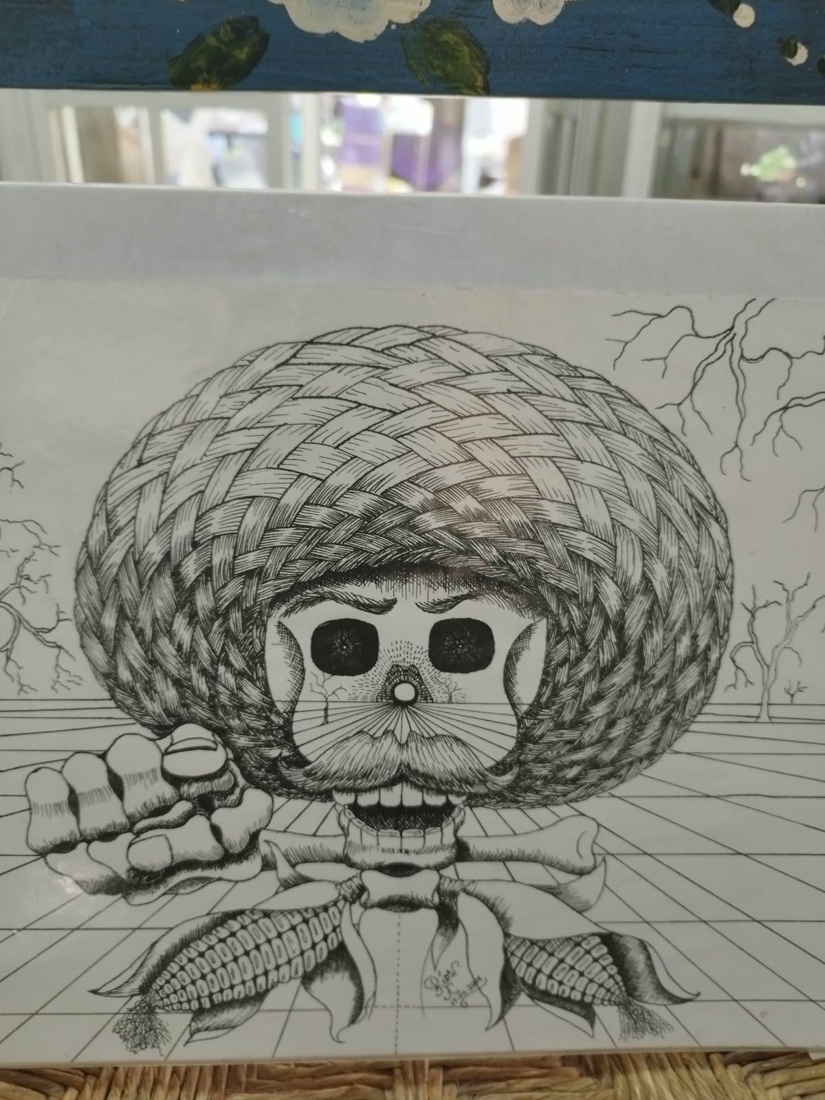 Dibujo en blanco y negro de una calavera con sombrero
